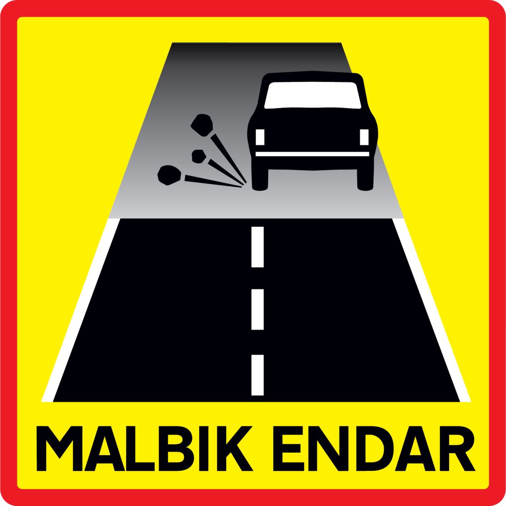 Pavement changes to gravel road sign